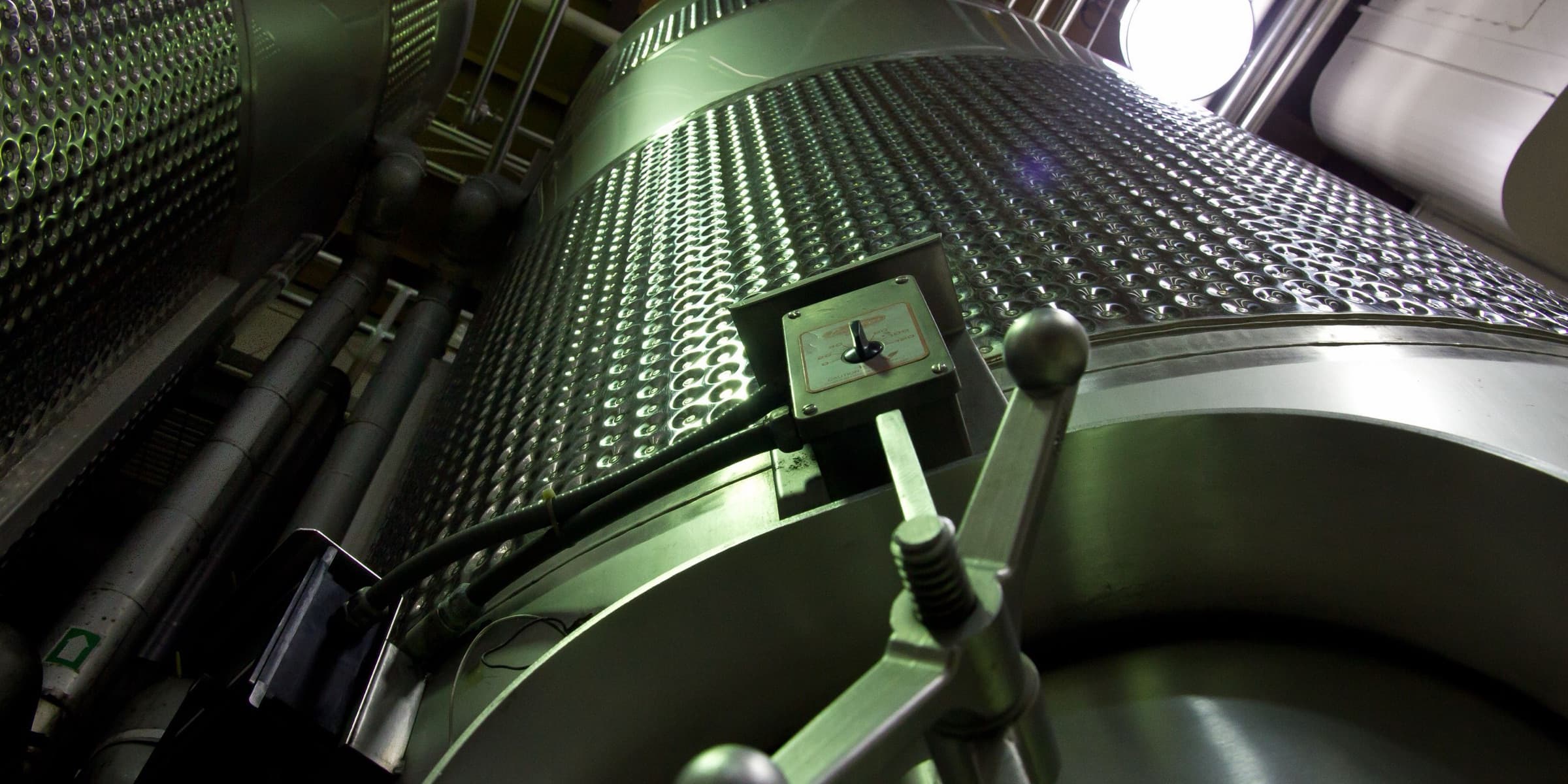 Large stainless steel tanks in an industrial facility